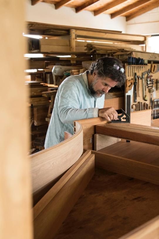 Mario Donadio in his shop building a Harpischord